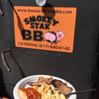 Smokey Stax BBQ Catering - a person holding a plate of food - Caterers Near Me Smokey Stax BBQ Catering - a person holding a plate of food - Caterers Near Me