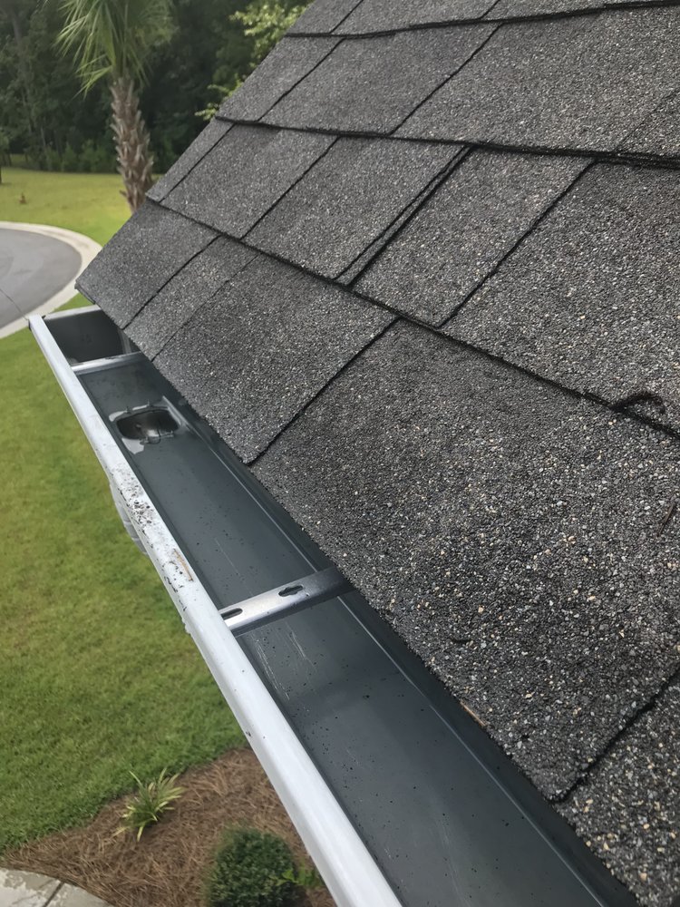 Slide of Gutter Clutter Cleaning & Roof Repair
