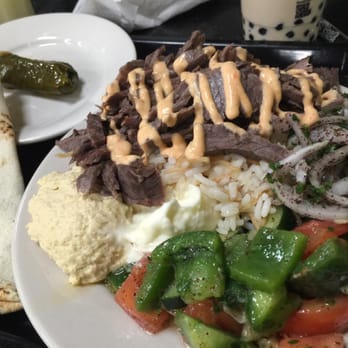 Garlic 'n Lemons - Tangy veggies, well seasoned beef, over a bed of rice. - Middle Eastern Near Me - Boston, Massachusetts