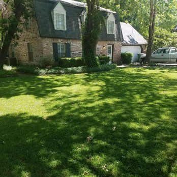 Mow Managers - a house in a residential neighborhood - Lawn Services Near Me