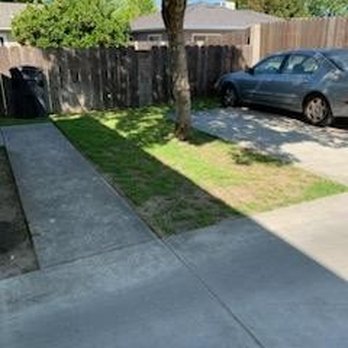 Complete Landscaping And Gardening - a driveway with a fence and a car parked in the driveway - Landscaping Near Me Complete Landscaping And Gardening - a driveway with a fence and a car parked in the driveway - Landscaping Near Me