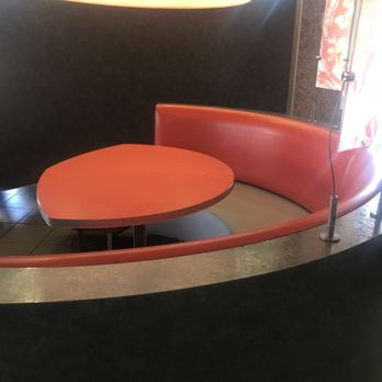 McDonald's - Seating area with a dirty table. - Burgers Near Me - Atmore, Alabama