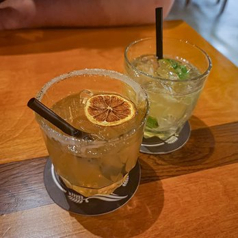 Chez Ernest - two cocktails on a wooden table - Bars Near Me - Montreal, Quebec