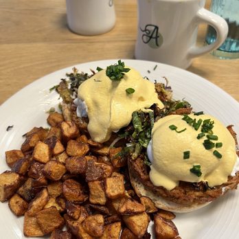 Ancora Cafe + Bakery - Eggs Benedict (it's a little spicy!) with breakfast potatoes - Breakfast & Brunch Near Me - Madison, Wisconsin
