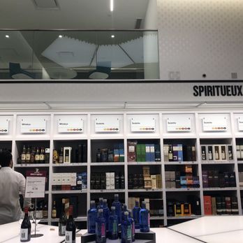 SAQ - a man and a woman in a store - Beer, Wine & Spirits Near Me - Montreal, Quebec SAQ - a man and a woman in a store - Beer, Wine & Spirits Near Me - Montreal, Quebec