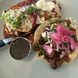 Carne asada taco and chicken enchilada Carne asada taco and chicken enchilada