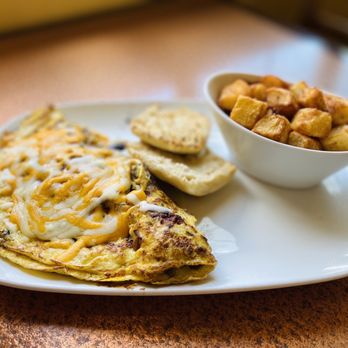 Another Broken Egg Cafe - The Supreme Omelette with Spinach & fresh country potatoes - Breakfast & Brunch Near Me - Dunwoody, Georgia