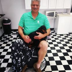 Barber Cuts and Styles - Happy client and Wally the pup.