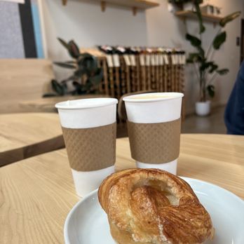 Sound & Fog - a croissant on a plate with two cups of coffee - Cafes Near Me - Seattle, Washington Sound & Fog - a croissant on a plate with two cups of coffee - Cafes Near Me - Seattle, Washington