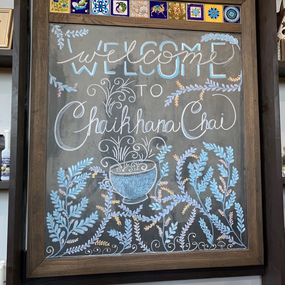 a chalk board with a welcome sign a chalk board with a welcome sign