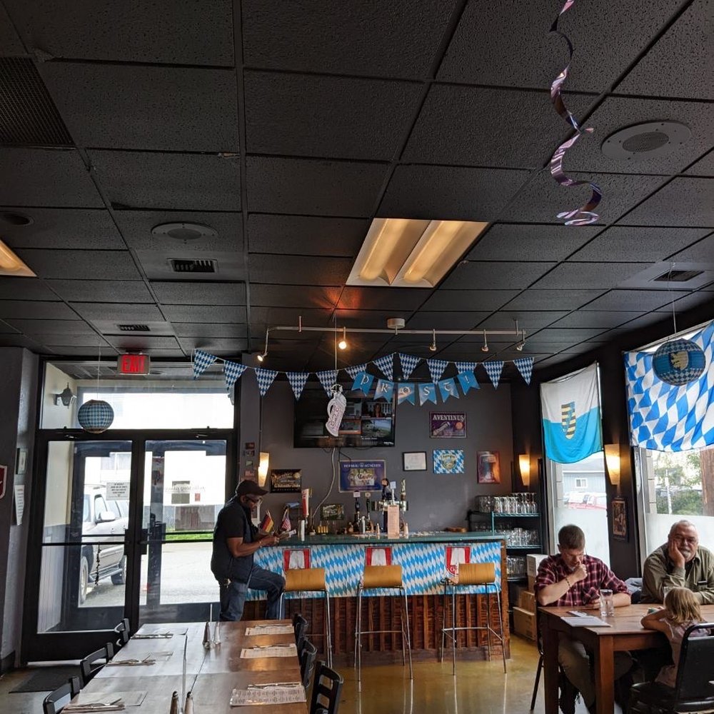 West Berlin - people sitting at tables in a restaurant - German Near Me - Anchorage, Alaska West Berlin - people sitting at tables in a restaurant - German Near Me - Anchorage, Alaska