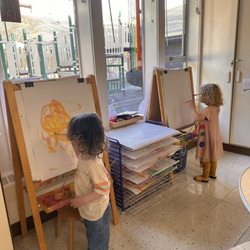 Youngset Cooperative Preschool - I love the easels by the windows for our preschoolers to be inspired by!