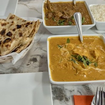 Persis Indian Grill - Chicken Chettinadu (top) and Chicken Tikka Masala (bottom) with garlic naan and roti. - Indian Near Me - Melbourne, Florida Persis Indian Grill - Chicken Chettinadu (top) and Chicken Tikka Masala (bottom) with garlic naan and roti. - Indian Near Me - Melbourne, Florida