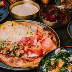 Safta - Delicious spread of our dishes (pictured Malawach, French Toast, Beet Salad, and more)
