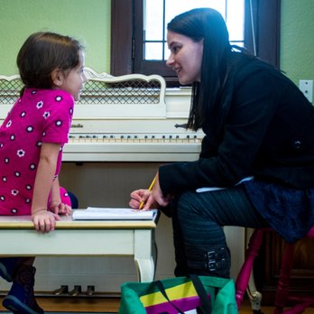 Hands in Harmony Piano Studio - Ms. EL working with one of our younger students. - Musical Instruments & Teachers Near Me - Milwaukee, Wisconsin Hands in Harmony Piano Studio - Ms. EL working with one of our younger students. - Musical Instruments & Teachers Near Me - Milwaukee, Wisconsin