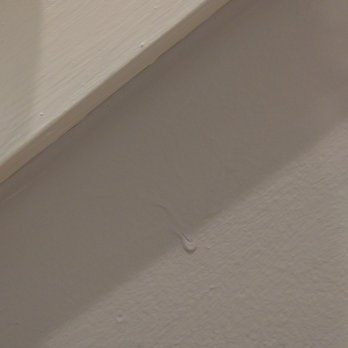 About The House Remolding - There are huge paint drips literally everywhere, including just in the middle of walls, as shown here. - Painters Near Me