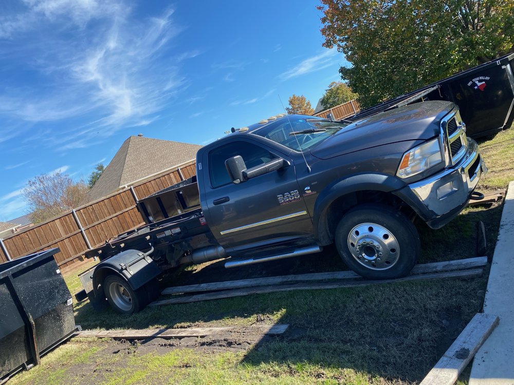 Slide of Ortiz roofing & dumpsters