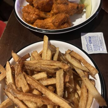 Jake Melnick's Corner Tap - 8-Wings (mid hot sauce) side of fries - Sports Bars Near Me - Chicago, Illinois Jake Melnick's Corner Tap - 8-Wings (mid hot sauce) side of fries - Sports Bars Near Me - Chicago, Illinois