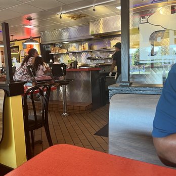 City Diner - a man sitting at a table with chopsticks in front of him - Breakfast & Brunch Near Me - Richmond, Virginia City Diner - a man sitting at a table with chopsticks in front of him - Breakfast & Brunch Near Me - Richmond, Virginia