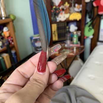 Headlines Salon - (Was actually sending this to my dgtr bcz her bird lost a feather-but it's not too bad a pic of my coffin nails) By me/on me. - Hair Salons Near Me - Tulare, California