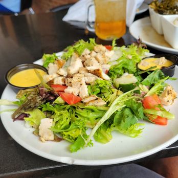 Rev Cafe - a plate of salad and a glass of orange juice - Bars Near Me - Monticello, Florida Rev Cafe - a plate of salad and a glass of orange juice - Bars Near Me - Monticello, Florida