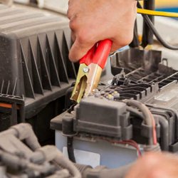 Intercontinental Towing Harrison - Harrison Tow Truck Company towing mechanic giving a jump start to disabled car vehicle with a dead battery Rye Mamaroneck Por...