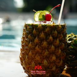 Red Pelican Bar and Hookah Lounge - Picture this: A perfect pineapple in one hand, while you feel the relaxing ocean breeze on your face and you are having the best time with y