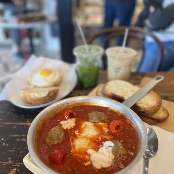 Tatte Bakery & Cafe | Arlington - Lamb Meat Ball Shakshuka & Halloumi Sunny-Side Breakfast Sandwich - Bakeries Near Me - Arlington, Massachusetts Tatte Bakery & Cafe | Arlington - Lamb Meat Ball Shakshuka & Halloumi Sunny-Side Breakfast Sandwich - Bakeries Near Me - Arlington, Massachusetts
