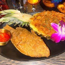 Royal Fusion - Jollof Royal Pineapple Fried Rice with red snapper