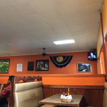 Los Maguey - a woman sitting at a table in a restaurant - Mexican Near Me - Summerville, Georgia Los Maguey - a woman sitting at a table in a restaurant - Mexican Near Me - Summerville, Georgia