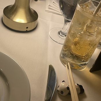 Philippe Chow - a glass of water and chopsticks on a table - Chinese Near Me - New York, New York Philippe Chow - a glass of water and chopsticks on a table - Chinese Near Me - New York, New York