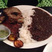 Photo of Geo's Cuban & Creole Cafe - Seattle, WA, United States. Ribs platter with black beans and rice. Meat slid off the bone.