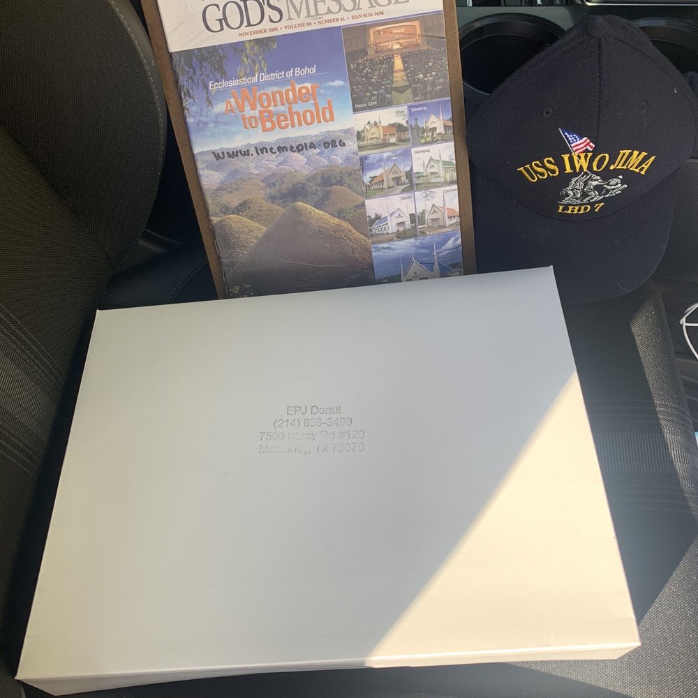 EPJ Donuts - a book, hat, and other items in the back seat of a car - Donuts Near Me - McKinney, Texas