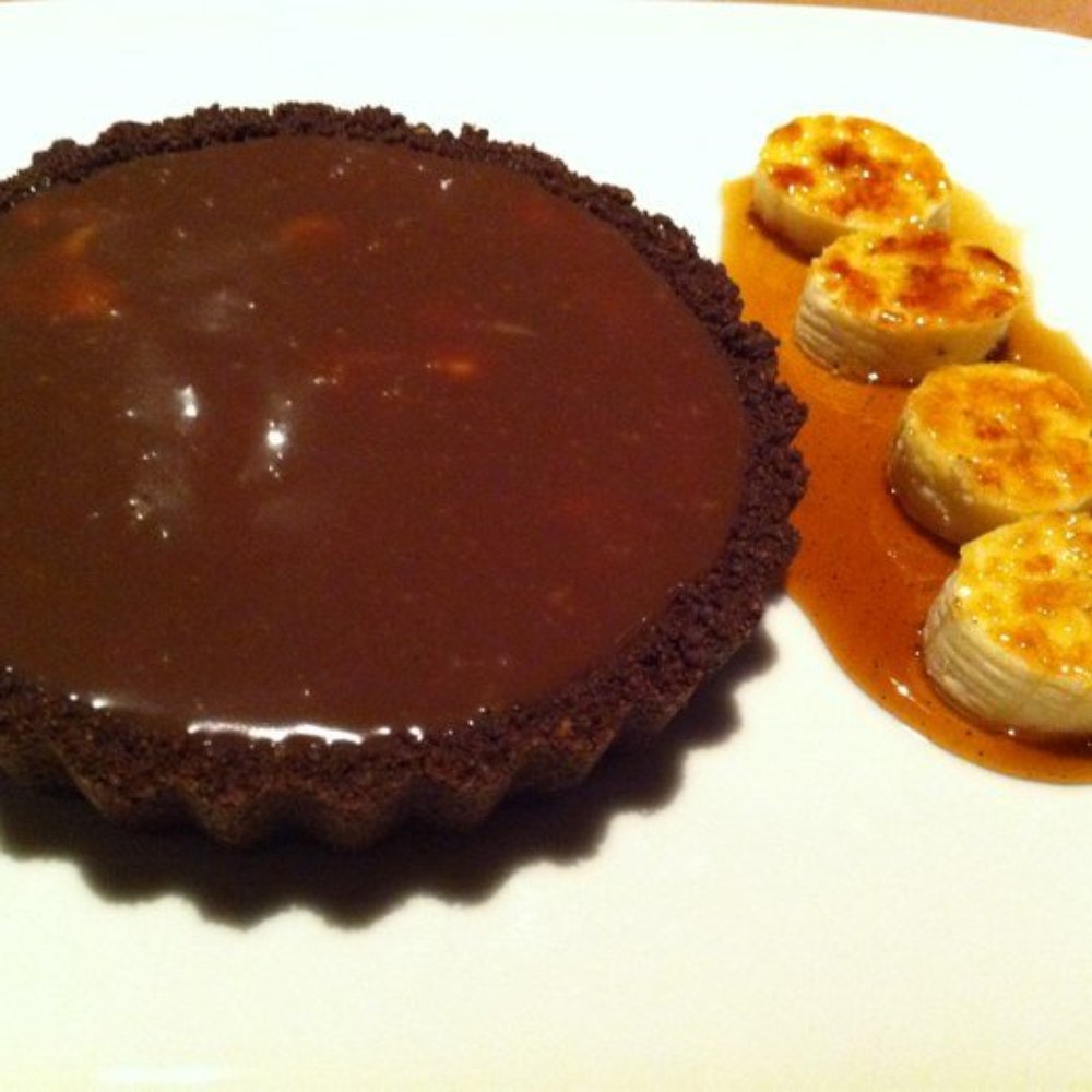 Pamplemousse Grille - Banana cream tart with milk chocolate ganache, carmelized bananas & espresso syrup...this was so yummy! - New American Near Me - Solana Beach, California