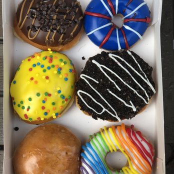 Krispy Kreme - from top left, down: Caramel sea salt, cake batter, raspberry filled. Too right, down: (can't remember) , oreo and pride - Donuts Near Me - Jersey City, New Jersey Krispy Kreme - from top left, down: Caramel sea salt, cake batter, raspberry filled. Too right, down: (can't remember) , oreo and pride - Donuts Near Me - Jersey City, New Jersey
