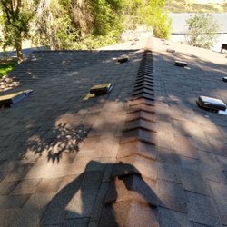 Henris Roofing & Supply - Lots of crazy angles and trickly flat-roof sections.  Henris met challenge!!!