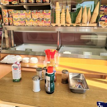 Sunland Donuts - a table with ice cream and condiments - Bakeries Near Me - Downey, California Sunland Donuts - a table with ice cream and condiments - Bakeries Near Me - Downey, California