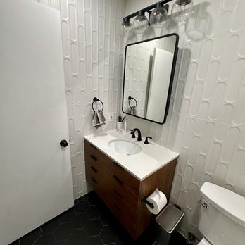 Bespoke Builders - Black hexagon floor and white fishscale wall tiling, and floating vanity - General Contractors Near Me Bespoke Builders - Black hexagon floor and white fishscale wall tiling, and floating vanity - General Contractors Near Me
