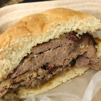 Pig Candy BBQ - Brisket Sandwich (cut in half for show) not shy on meat. - Barbeque Near Me - Cincinnati, Ohio Pig Candy BBQ - Brisket Sandwich (cut in half for show) not shy on meat. - Barbeque Near Me - Cincinnati, Ohio