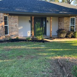 Prime Property Cleanup - After picture of flower bed and lawn