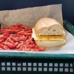Cheddar and pepper jack cheese sandwich and a sweet roll. Cheddar and pepper jack cheese sandwich and a sweet roll.