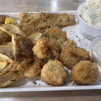 The Fish Joint - Trio platter fries. Shrimp, scallops, and Mahi. Wanted Grouper but that was a $12 upcharge. - Seafood Near Me - Coconut Creek, Florida The Fish Joint - Trio platter fries. Shrimp, scallops, and Mahi. Wanted Grouper but that was a $12 upcharge. - Seafood Near Me - Coconut Creek, Florida