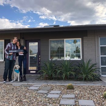 Carissa Vivirito - EVOLVE - Young couple with puppy holding a sign that reads "Dream House", in front of a ranch style home with a desert landscape. - Real Estate Agents Near Me - Scottsdale, Arizona Carissa Vivirito - EVOLVE - Young couple with puppy holding a sign that reads "Dream House", in front of a ranch style home with a desert landscape. - Real Estate Agents Near Me - Scottsdale, Arizona