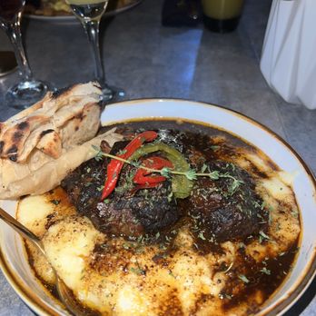 Madame Fortune - oxtails and grits  (with roti) - Caribbean Near Me - Tampa, Florida