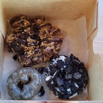 Voodoo Doughnut - Memphis mafia $5.25, dirt $2.25, blueberry cake $1.25. Blueberry was our fav, but all were good. All pretty sweet!! - Donuts Near Me - Denver, Colorado Voodoo Doughnut - Memphis mafia $5.25, dirt $2.25, blueberry cake $1.25. Blueberry was our fav, but all were good. All pretty sweet!! - Donuts Near Me - Denver, Colorado