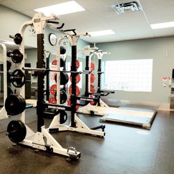 GoodLife Fitness - Squat racks and an Olympic lifting platform