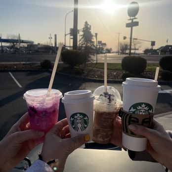 Starbucks - two people holding cups of iced coffee - Coffee & Tea Near Me - Moses Lake, Washington Starbucks - two people holding cups of iced coffee - Coffee & Tea Near Me - Moses Lake, Washington