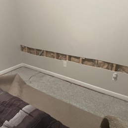 The area that was cut out and the carpet pulled back showing the padding.