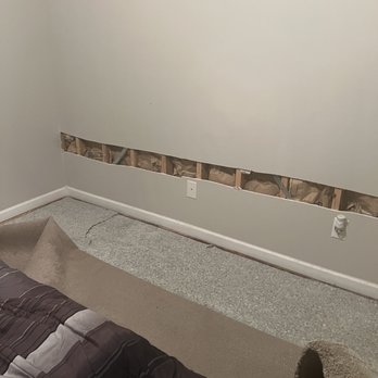 Jayk's LLC Plumbing Repairs, Renovations & More - The area that was cut out and the carpet pulled back showing the padding. - Plumbing Near Me
