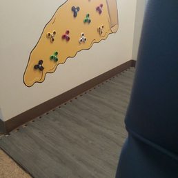 The kid's play area...figet spinners on a pizza slice.